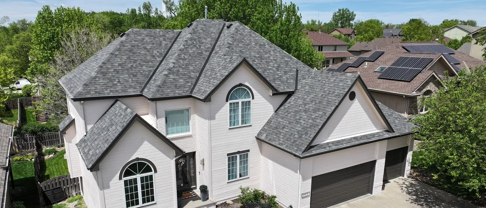 Completed architectural-shingle roof replacement on a two-story Omaha home